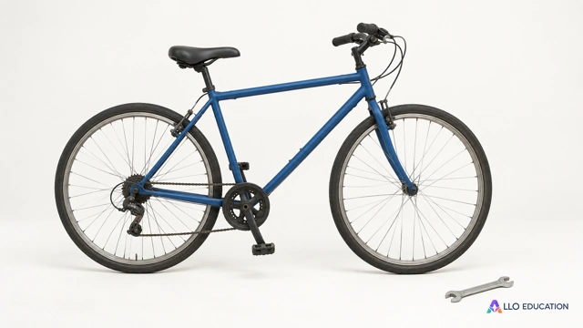 Un vélo d’occasion uni et une petite clé de réparation, sans marque ni inscription, isolés sur fond clair.